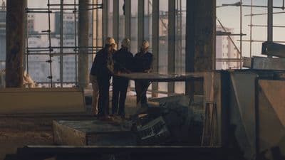 a group of people standing next to each other in a building