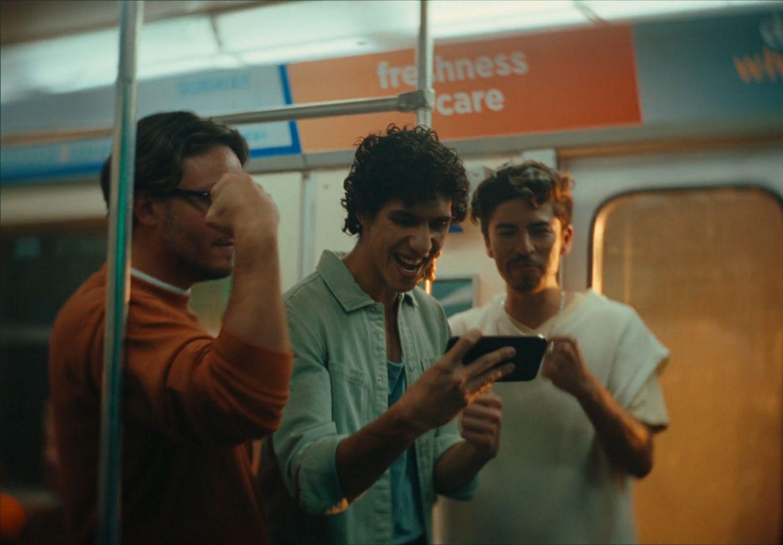a group of men standing next to each other on a train