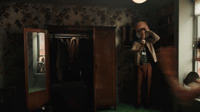a person standing in a room with a mirror