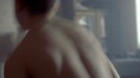 a blurry image of a man with no shirt on
