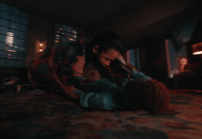 a couple of people laying on top of a bed