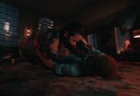 a couple of people laying on top of a bed