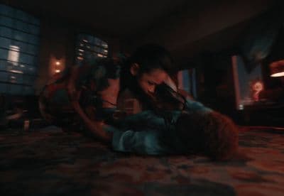 a couple of people laying on top of a bed
