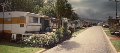 a row of parked rvs sitting next to each other