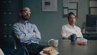 a man and a woman sitting at a table