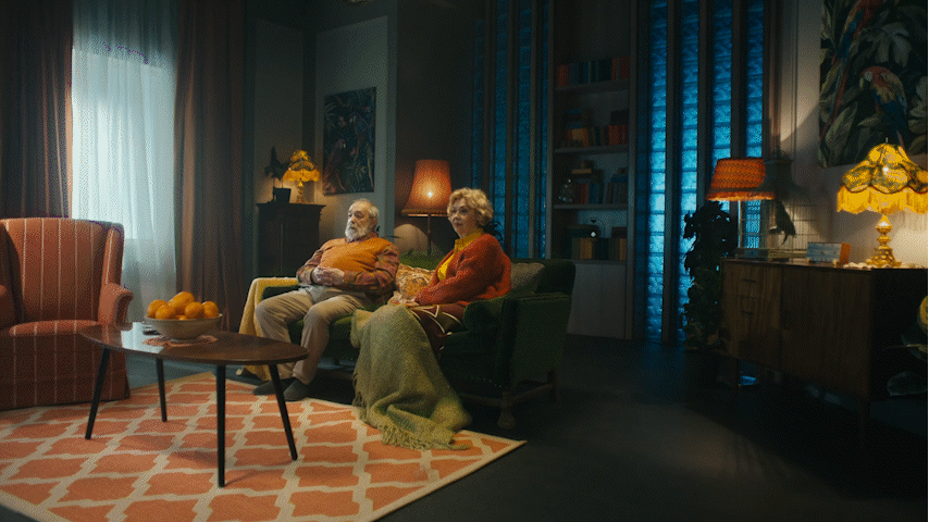 a couple of people that are sitting in a room