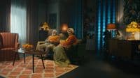 a couple of people that are sitting in a room