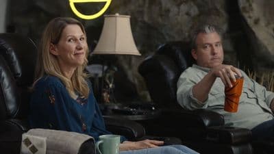 a man and a woman sitting in a chair