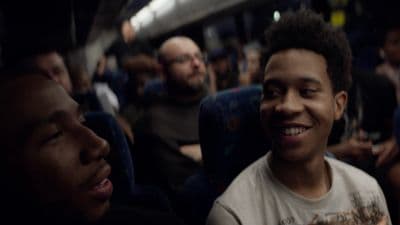 a group of people sitting on a train together