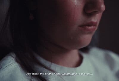 a close up of a person with a sad look on their face