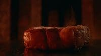 a piece of meat sitting on top of a table