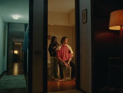 a couple of people standing in a doorway