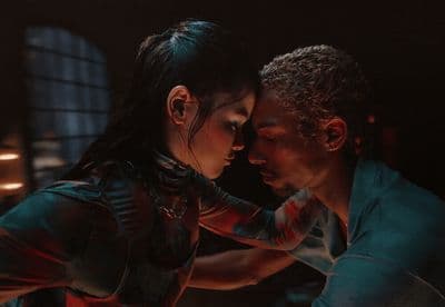 a man and a woman dance together in the dark