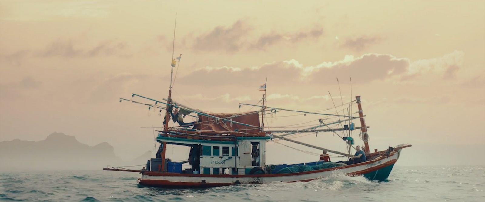 a fishing boat in the middle of the ocean
