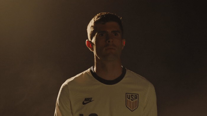 a man in a soccer uniform is posing for a picture
