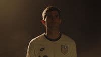 a man in a soccer uniform is posing for a picture