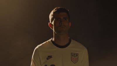 a man in a soccer uniform is posing for a picture