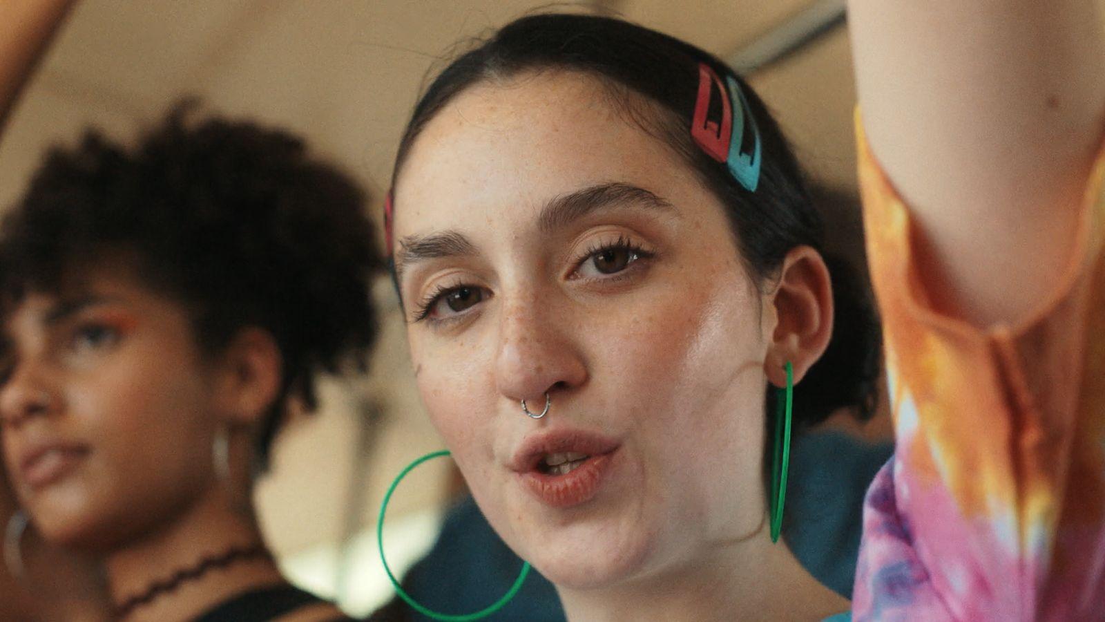 a woman with ear piercings on her nose