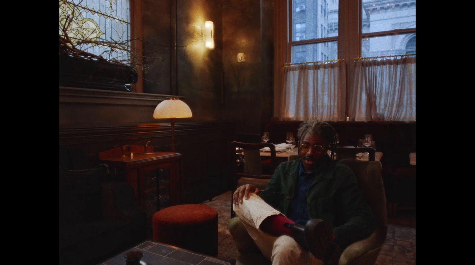 a man sitting in a chair in a room