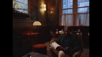a man sitting in a chair in a room