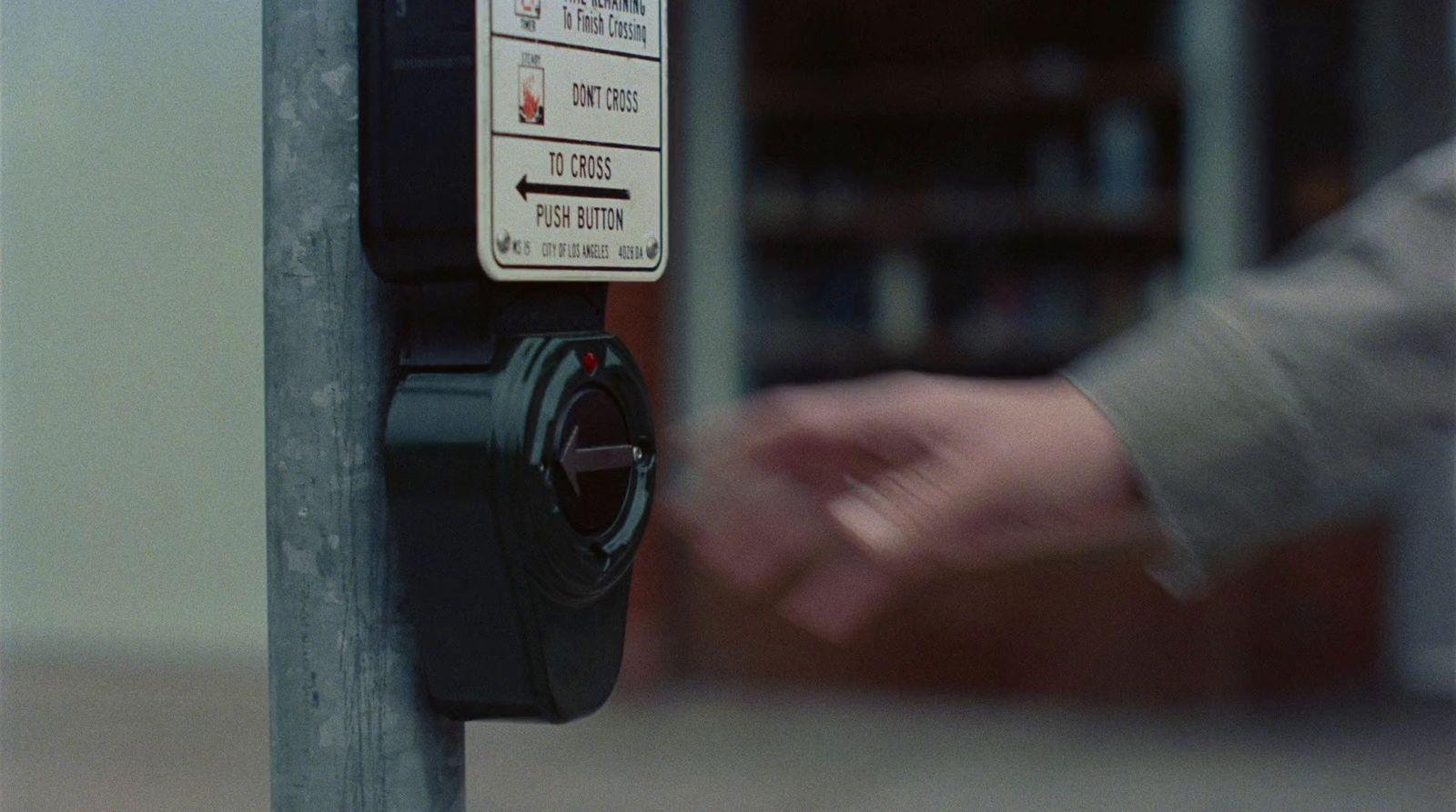 a parking meter with a hand on it