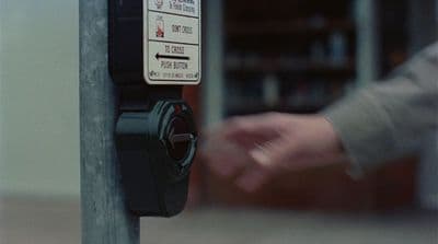 a parking meter with a hand on it