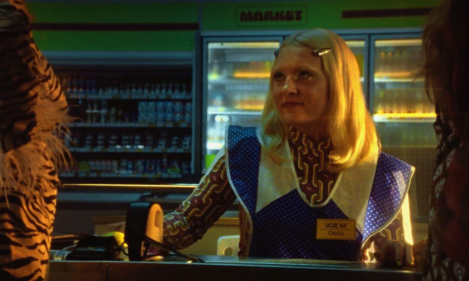 a woman sitting at a counter in a store