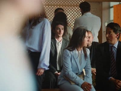 a group of people sitting next to each other