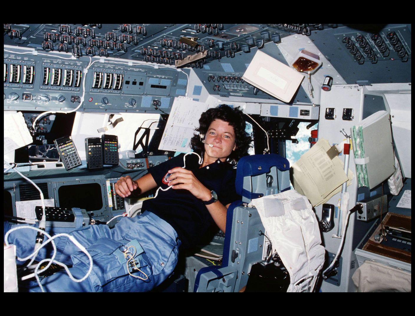 a man sitting in the cockpit of an airplane