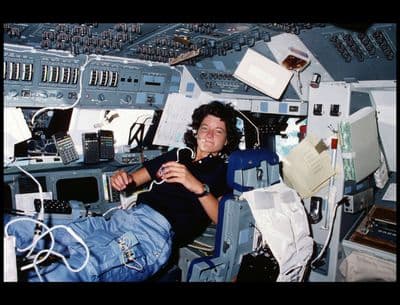 a man sitting in the cockpit of an airplane