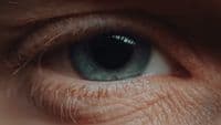 a close up of a person's blue eye