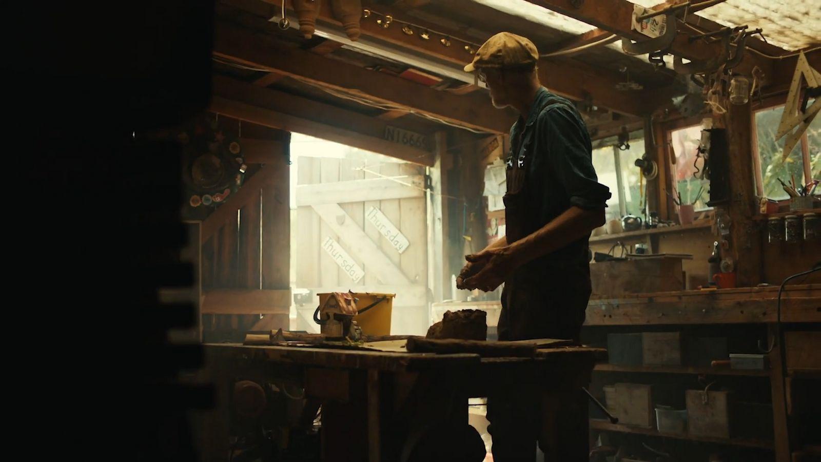 a man is working in a wood shop
