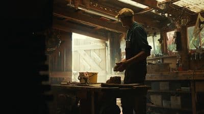 a man is working in a wood shop