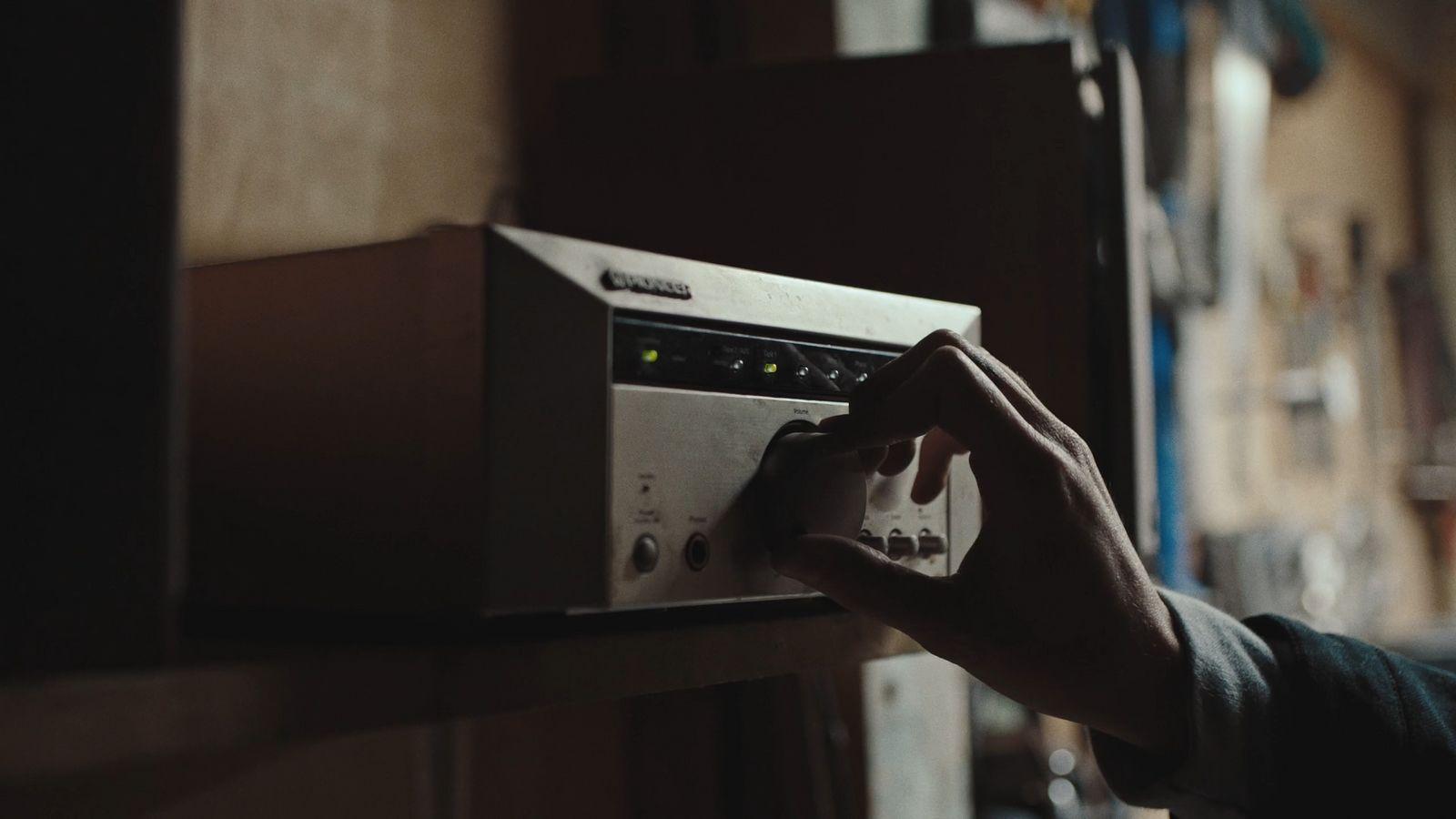 a person is pressing buttons on a microwave