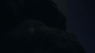 a blurry photo of a person in the dark