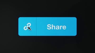 a close up of a blue sign with a black background