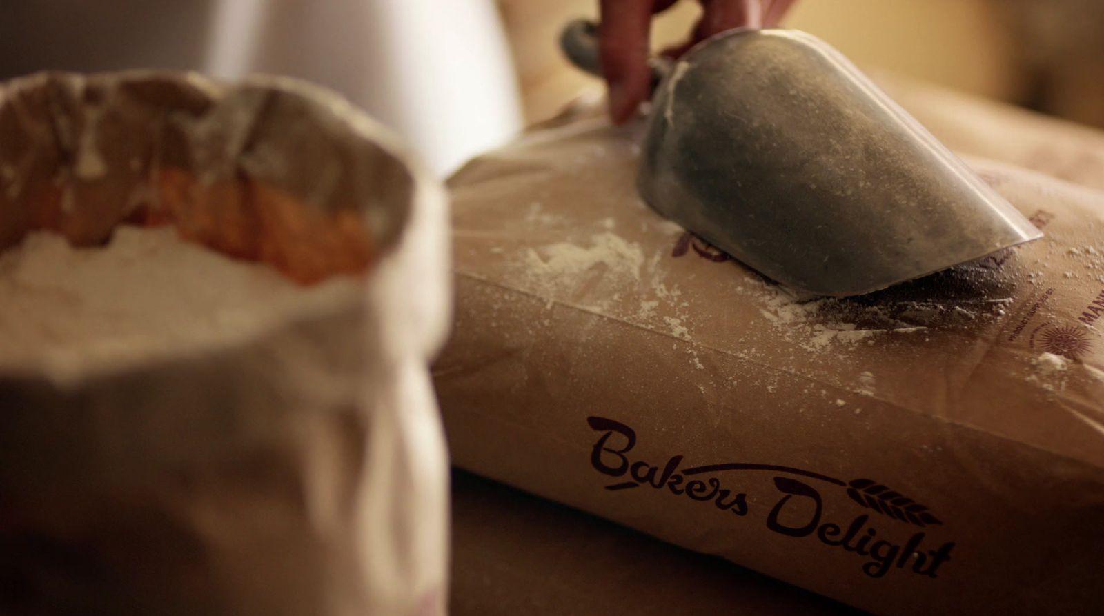 a person using a pastry cutter on a bag