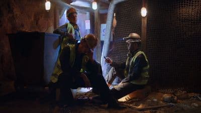 a group of men standing next to each other in a tunnel