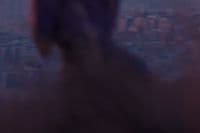 a blurry photo of a person standing in front of a window