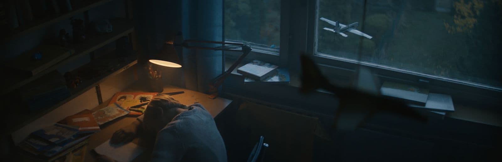 a room with a desk and a window