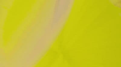 a close up of a yellow and pink background