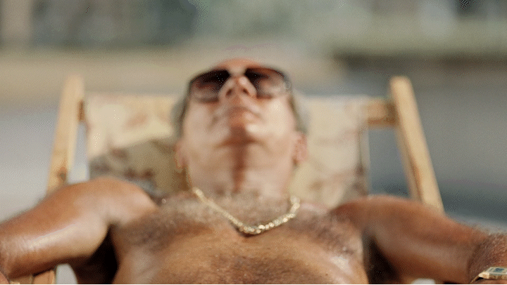 a man in a chair with his eyes closed