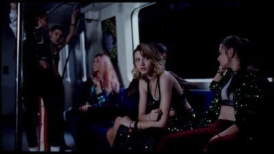 a group of women sitting next to each other on a train