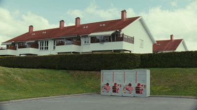 a large white house with a red roof
