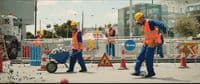 a group of construction workers standing next to each other