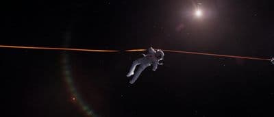 two people are in the air on a tightrope
