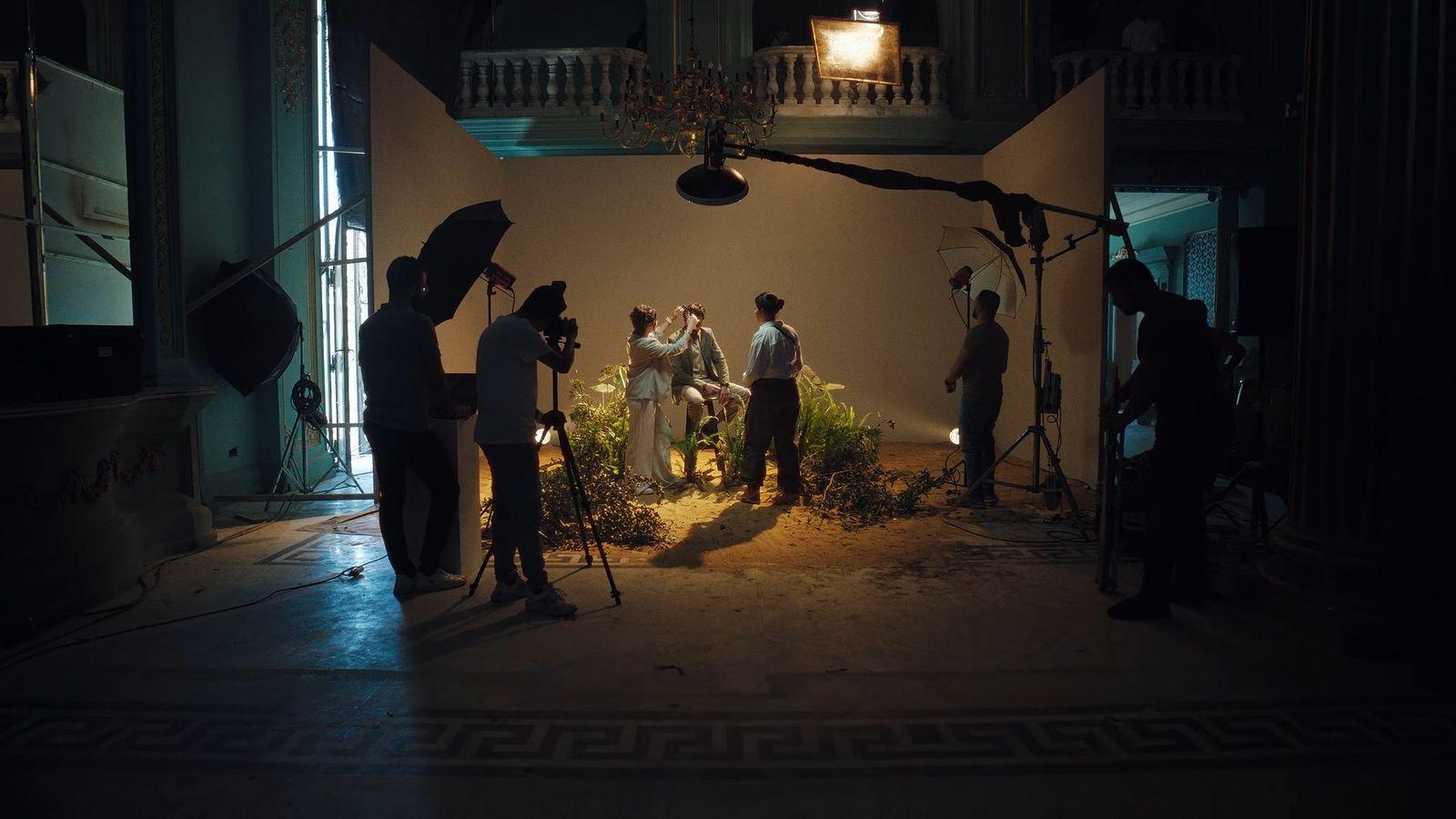 a group of people standing in front of a camera
