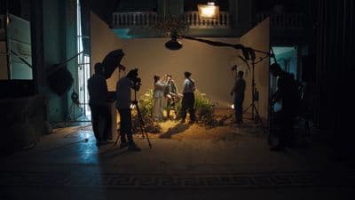 a group of people standing in front of a camera