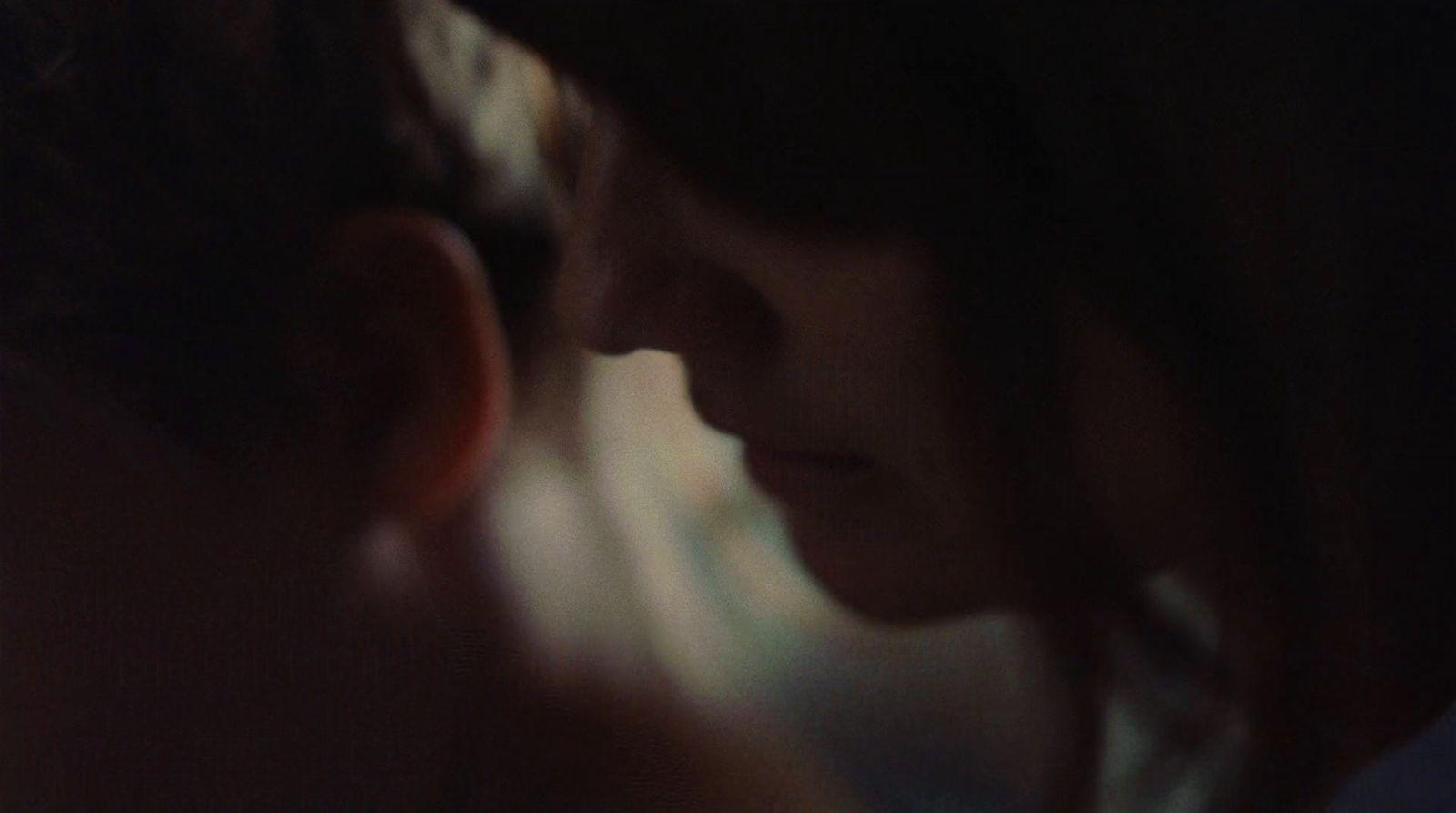a close up of a person's face with a blurry background