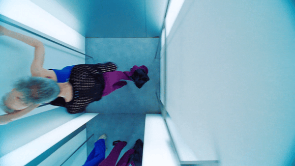 a woman is standing in the middle of a room